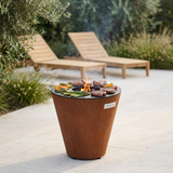 Arteflame ONE20 used as a grill with steak and vegetables cooking on its flat-top ring