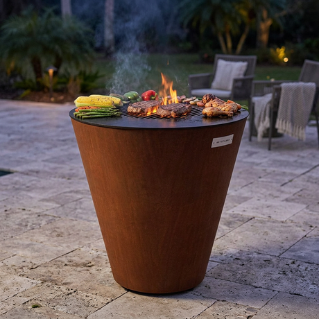 Arteflame ONE30 with food cooking on the outer cooktop and central grate over a live fire