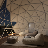 Dome interior concept with bean bag loungers facing a starry night view