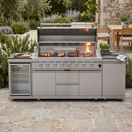 Grill island in action with the lid open, burners lit, and food cooking on the grates