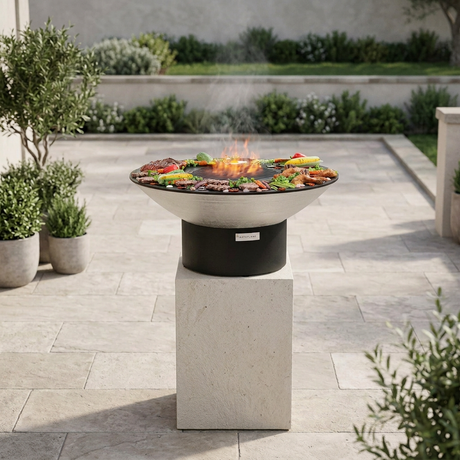 Grill on its tall stone pedestal in an outdoor setting, without the person