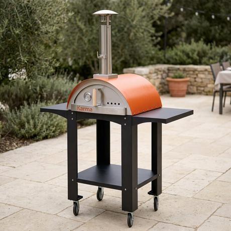Karma oven and cart in a natural stone-patio lifestyle setting