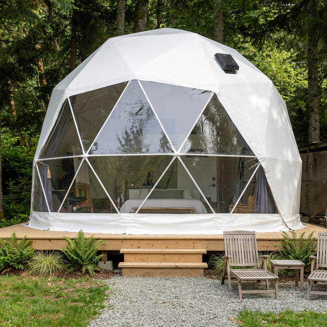 Patioza 16-foot Phoenix dome in a landscaped woodland setting