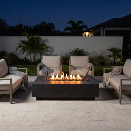 Patioza fire table lit on a chilly Florida night with surrounding lounge chairs