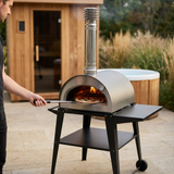 Pizzi oven in action with sauna and cold tub in the background