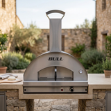 Revised Bull pizza oven lifestyle image in a cohesive outdoor kitchen