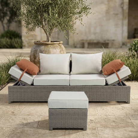 Salena sofa and ottoman in a softly lit garden terrace setting