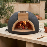 Tonío brick pizza oven action shot with a contained wood fire and no food inside